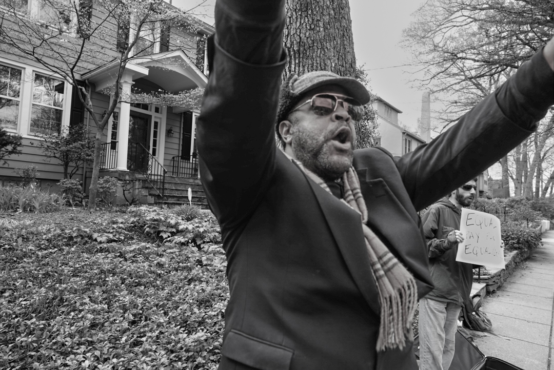 Activist holding a sign that you cannot see in black and white