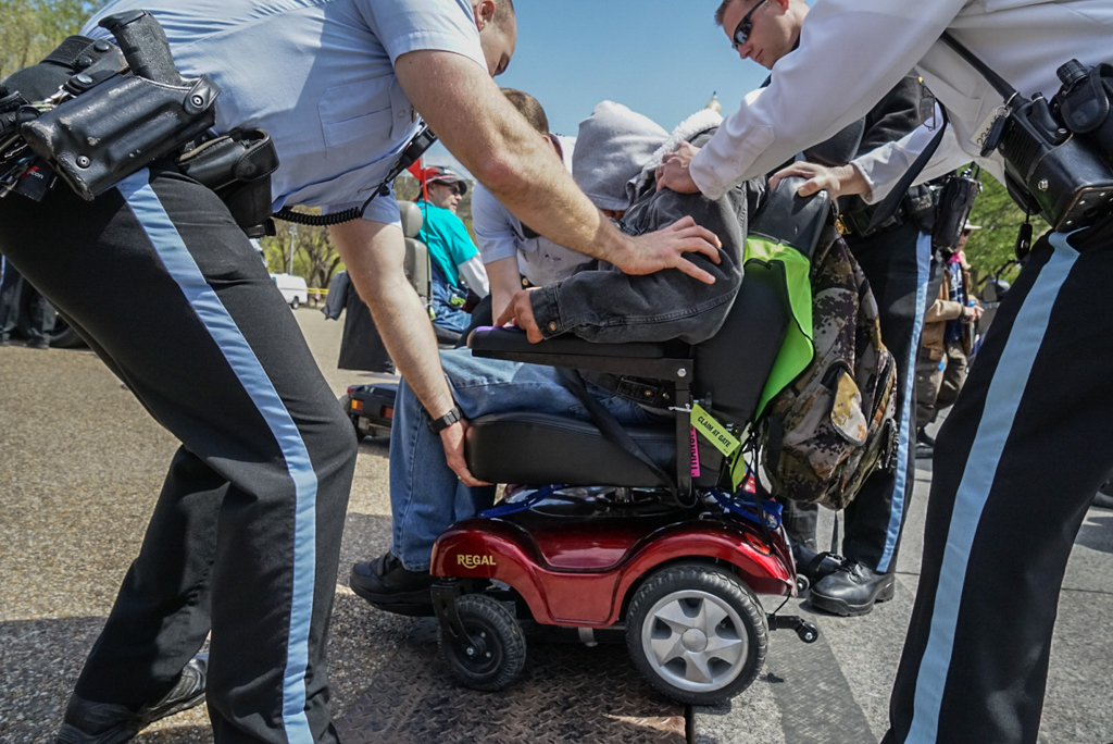  ADAPT activist being arrested 
